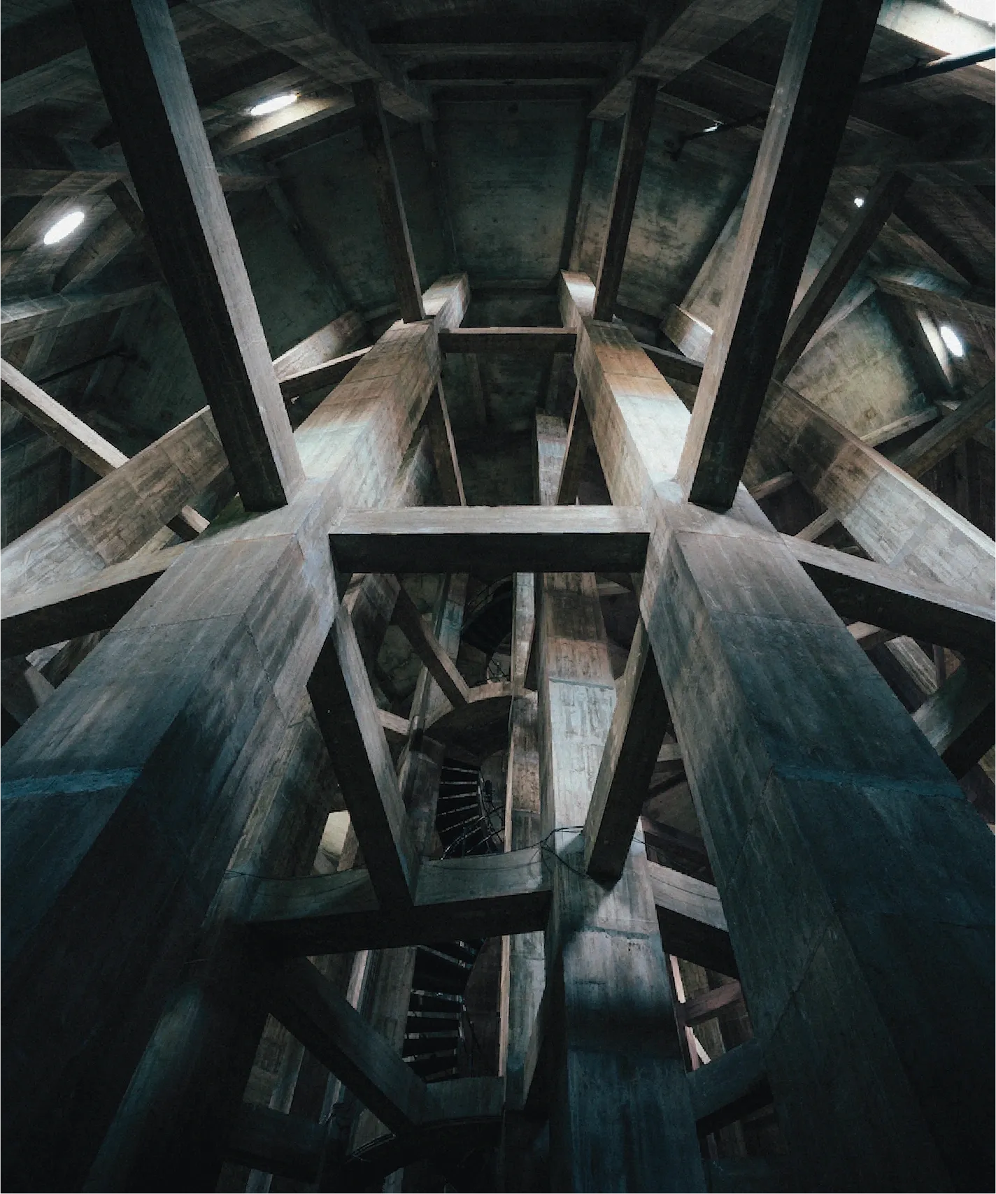 Looking up into the dim concrete interior of Brønshøj Water Tower.