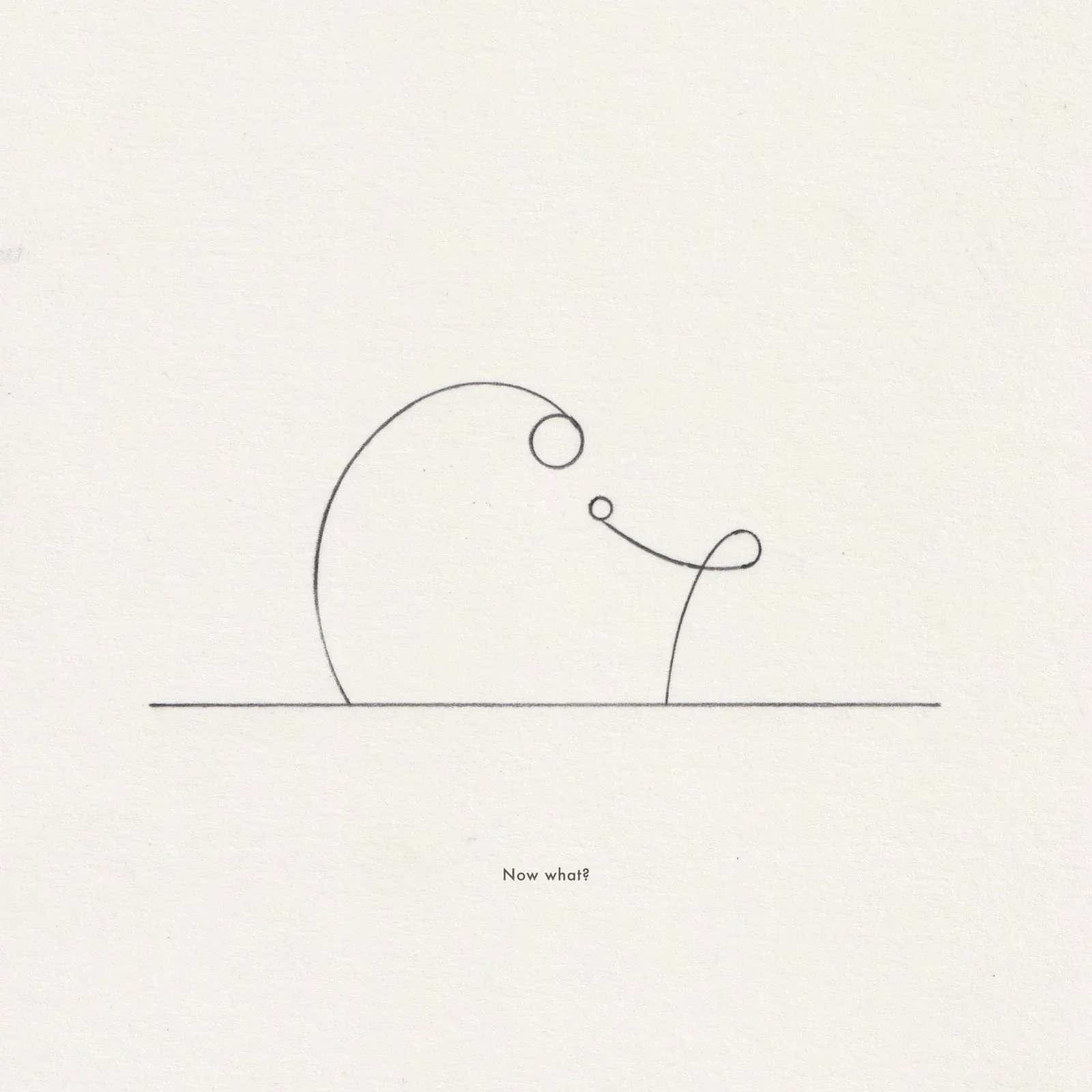 Pencil line drawing on paper: a large looping circle and small circles above a horizontal line, captioned 'Now what?'